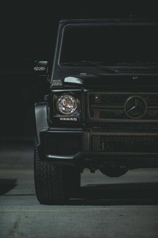 Luxury sports car headlight at night